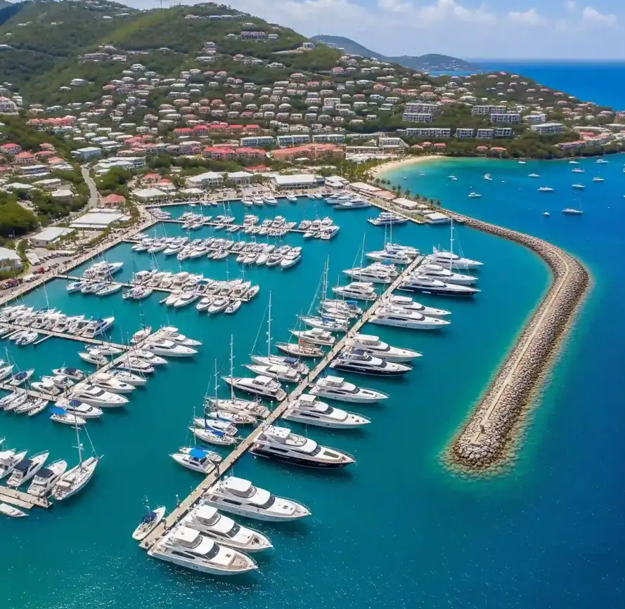 An aerial view of a bustling St. Thomas marina filled with yachts and sailboats.